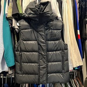 Nike down fill puffer vest with oversized hood.
